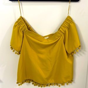Off the shoulder top, size small with Pom poms